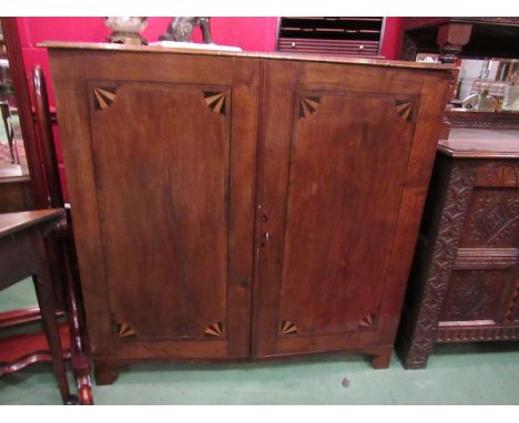 An early to mid 19th Century mahogany inlaid collector's cabinet, twin doors opening to reveal 20 graduating drawers with bra