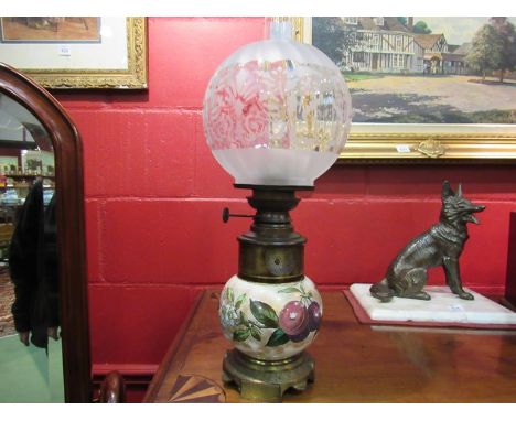 A 19th Century Royal Doulton oil lamp with floral design ceramic reservoir and etched glass shade 