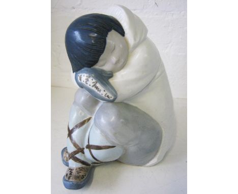 LLADRO ESKIMO BOY FIGURE, 20th century ceramic, designed by Juan Huerta, (issued 1970 and discontinued in 2005), 25cm H. 