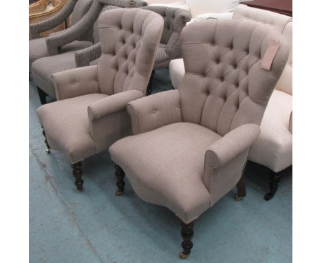 ARMCHAIRS, a pair, button back in neutral fabric on turned castor supports, 86cm W. (2)