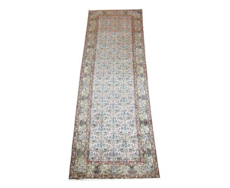 PURE SILK HEREKE RUNNER, 248cm x 75cm, mogul design on an ivory field within a palmette and vine border.