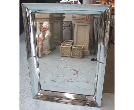MIRROR, with bevelled plate in a curved mirror surround, 113cm x 84cm. 