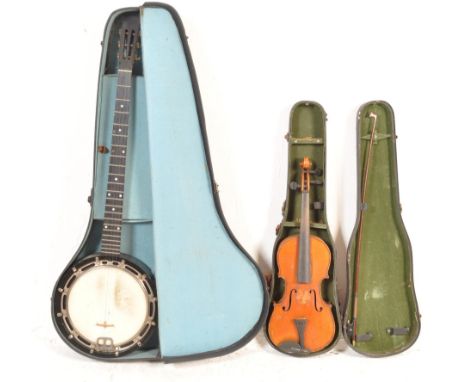 A collection of three vintage 20th century musical instruments comprising of a cased violin with bow, a banjo within a hardco