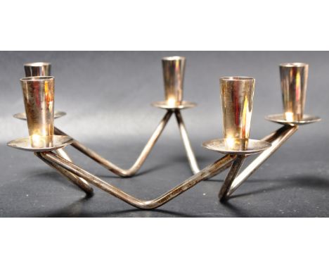 A vintage retro 20th century circa 1980’s silver plated star shaped candle holder by Berg, Denmark. The five sconce table can