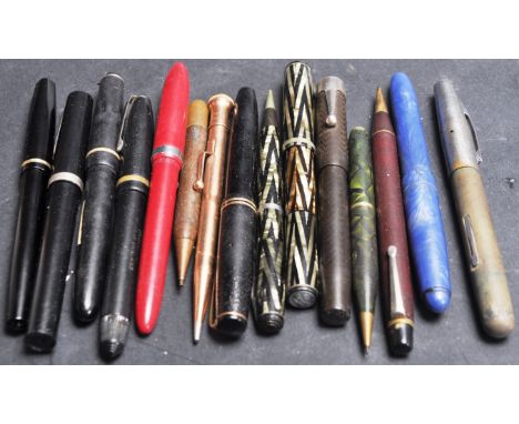 A collection of mid 20th century fountain pens and propelling pencils. Including Waterman's fountain pen with matching pencil