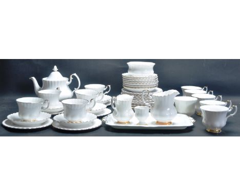 A vintage late 20th Century Royal Albert Val D’or pattern tea service. The service comprising of a teapot, 11 teacups, 12 sau