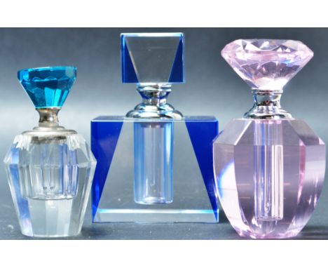A collection of three vintage 20th century glass scent bottles comprising of a pink glass scent bottle having a faceted glass