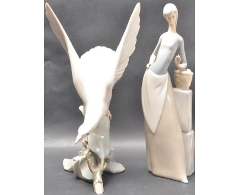 A Spanish Lladro ceramic porcelain figurine&nbsp;Turtle Dove - 4550, depicting a large dove landing on a branch together with