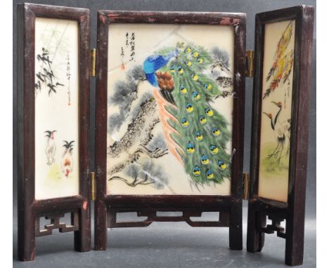 An early 20th century Chinese desktop miniature screen having ceramic panels decorated with peacocks and flowers.