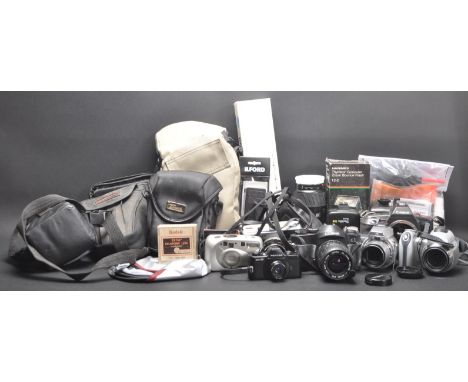 A collection of vintage 20th century camera equipment comprising of a EOS600, Minolta 75-300, Cosina C1 camera, Konica Minolt