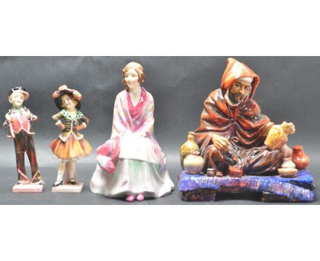 A collection of four Royal Doulton ceramic porcelain figurines. The collection comprising of: “ The Potter HN1490 - potted by