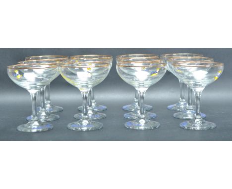 A set of twelve retro vintage Babycham glasses / cocktail glass of usual form with babycham logo printed on the side raised o
