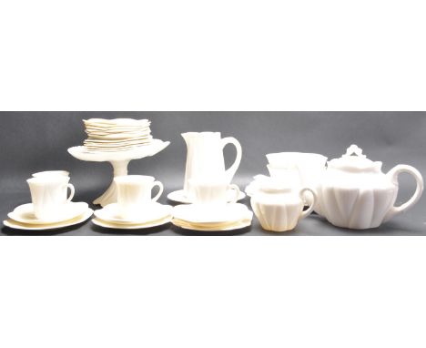 A late 19th Century Shelley Dainty pattern white tea service comprising of cups, saucers, creamer jug, bowls, teapot, side pl