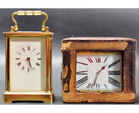 Two mid 20th century brass and glass carriage clocks / traveling clocks. One of a rectangular form with white enamel face, Ro