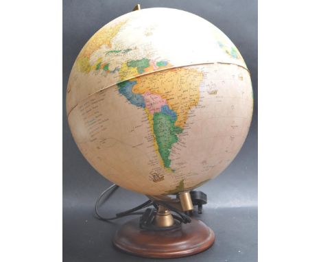 A vintage 20th century Technodidattica Italian made Illuminated globe raised on a circular wooden base. Gobe has capitals, sh