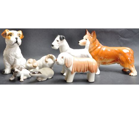 A collection of vintage 20th century ceramic dogs comprising of Royal Copenhagen, Nao, Royal Dux and more. Dog breeds include