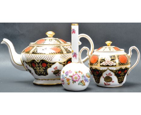 An Abbeydale Chrysanthemum pattern bone china teapot and sugar lidded bowl. Both ceramic pieces being decorated in Imari patt