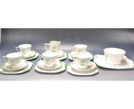 An early 20th century Art Deco four person Heathcote China tea service having polychrome floral decoration with makers mark t