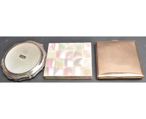 A collection of two 1970’s ladies compacts and a cigarette case. One of a circular form with scalloped edges, chrome body and