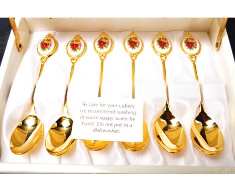 A set of vintage 20th century porcelain and gold plated Royal Albert Old Country Roses spoons having polychrome floral decora