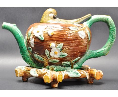 A 19th Century Victorian Majolica birds nest teapot in the manner of Minton / George Jones / Wedgwood. The teapot having a li