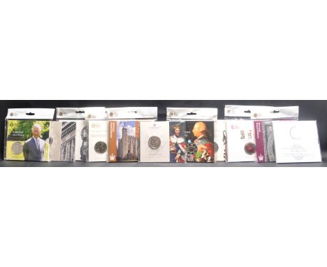 The Royal Mint - a collection of x11 Royal Mint £5 uncirculated presentation coins. Each mint, unopened, and as new. Includes