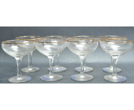 A set of eight retro vintage 20th century Babycham cocktail glasses of usual form with Babycham logo printed to the bowl rais