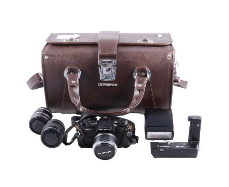 Olympus OM4 35mm camera and accessories, including a 35mm lens, 100mm lens, 24mm lens x2, 28mm lens, 75-150mm lens, 135mm len
