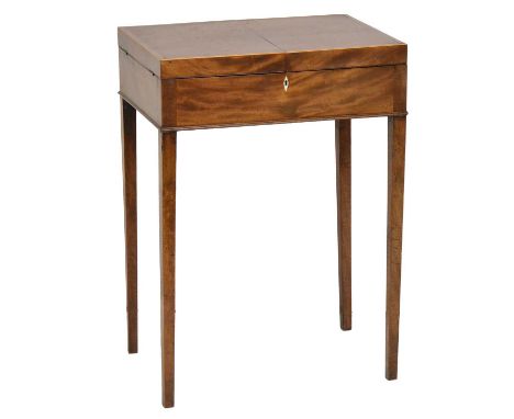 George III mahogany dressing table, flap-over top enclosing a fitted interior, with an adjustable mirror, supported on a ratc