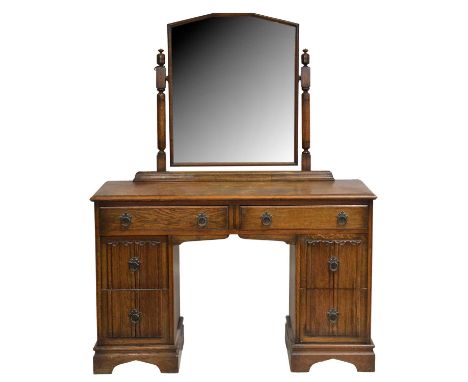 Oak three-piece bedroom suite, Inglesants, Leicester, with linen-fold and Gothic travery stye panelling, comprising a dressin