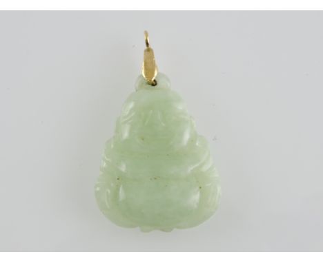 A carved jade pendant in the form of a Buddha with a yellow metal bale, 5.5g.