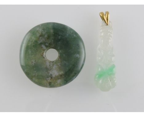 A carved jade Buddha pendant, on a yellow metal bale; together with a jade disc. (2)