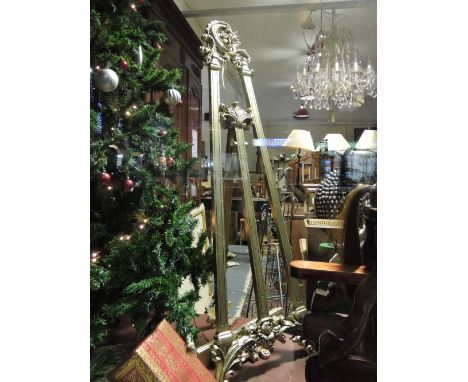 A silver gilt wood easel, with baroque carved surmount, H. 168cm.