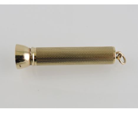 A 9ct gold cigar piercer, with an engine-turned cylindrical body, 16.5g.