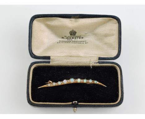 A diamond and opal bar brooch, set in yellow metal stamped 9ct, in retail box, 2.7g.