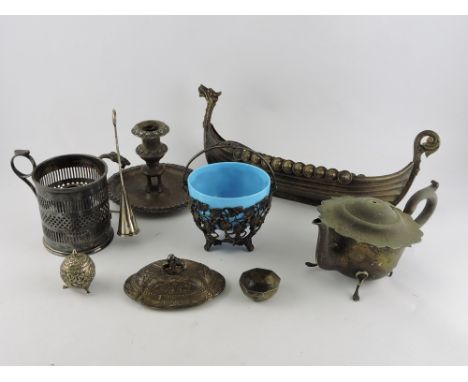 A quantity of silver plated ware, including a flower trough in the from of a Viking vessel, various items of cruet and a cham
