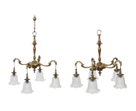 TWO SIMILAR ENGLISH GILT METAL CHANDELIERS
Circa 1900, in the Arts and Crafts taste, of matching design, one five light and o