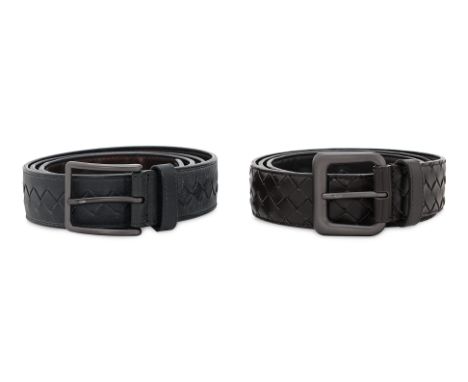 A PAIR OF BOTTEGA VENETA MEN'S LEATHER BELTS
Featuring the signature intrecciato weave, matte gunmetal-tone buckles, and mult