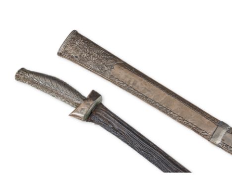 A JAVANESE PEDANG LURUS SWORD
20th century, straight folded iron ore blade, silver mounted handle decorated in leaf pattern, 