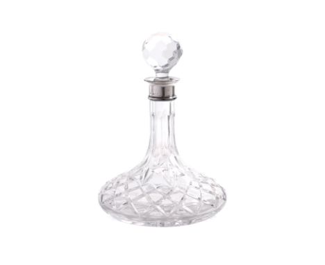 AN ENGLISH SILVER MOUNTED CUT GLASS SHIP'S DECANTER
K.M.Silver, Birmingham 1983, with faceted ball stopper and cut decoration