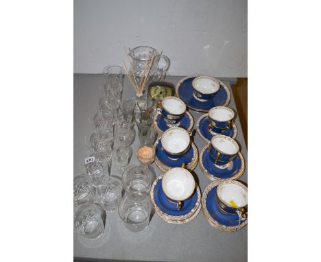 A Spode part tea set, pattern no. R5743, to include: cups, saucers and plates, on blue ground with gilding; together with cut