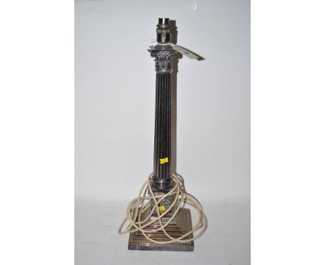 A silver-plated table lamp with corinthian column and square base.