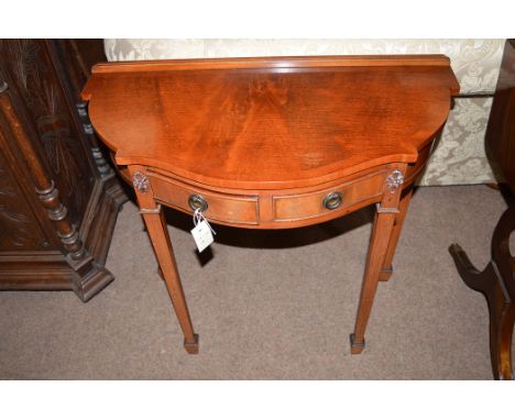 A reproduction mahogany console table, 75cms wide.