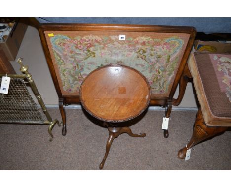 A mahogany firescreen with inset tapestry under glass; together with a reproduction mahogany wine table.