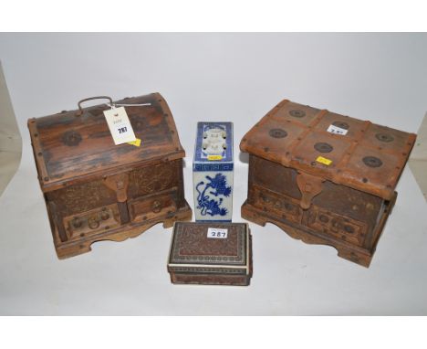 A Chinese ceramic blue and white pot pourri box; two hinged wooden boxes with metal mounts; and another.  (4)