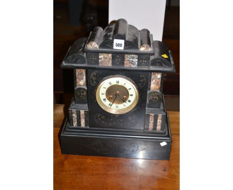 A Victorian mantel clock in polished slate and marble architectural style case, cream coloured circular dial with two winding