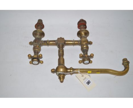 A brass mixer tap with ceramic tap heads inscribed 'Orient Express'.