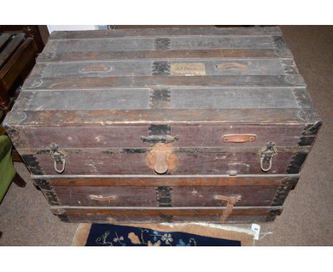 A large old wooden trunk with metal bindings.