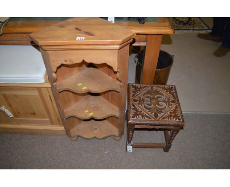 A small square carved wooden stool; together with a modern pine corner shelf unit.