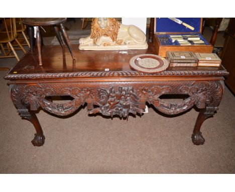 An Oriental carved and stained wood console table, 150cms.